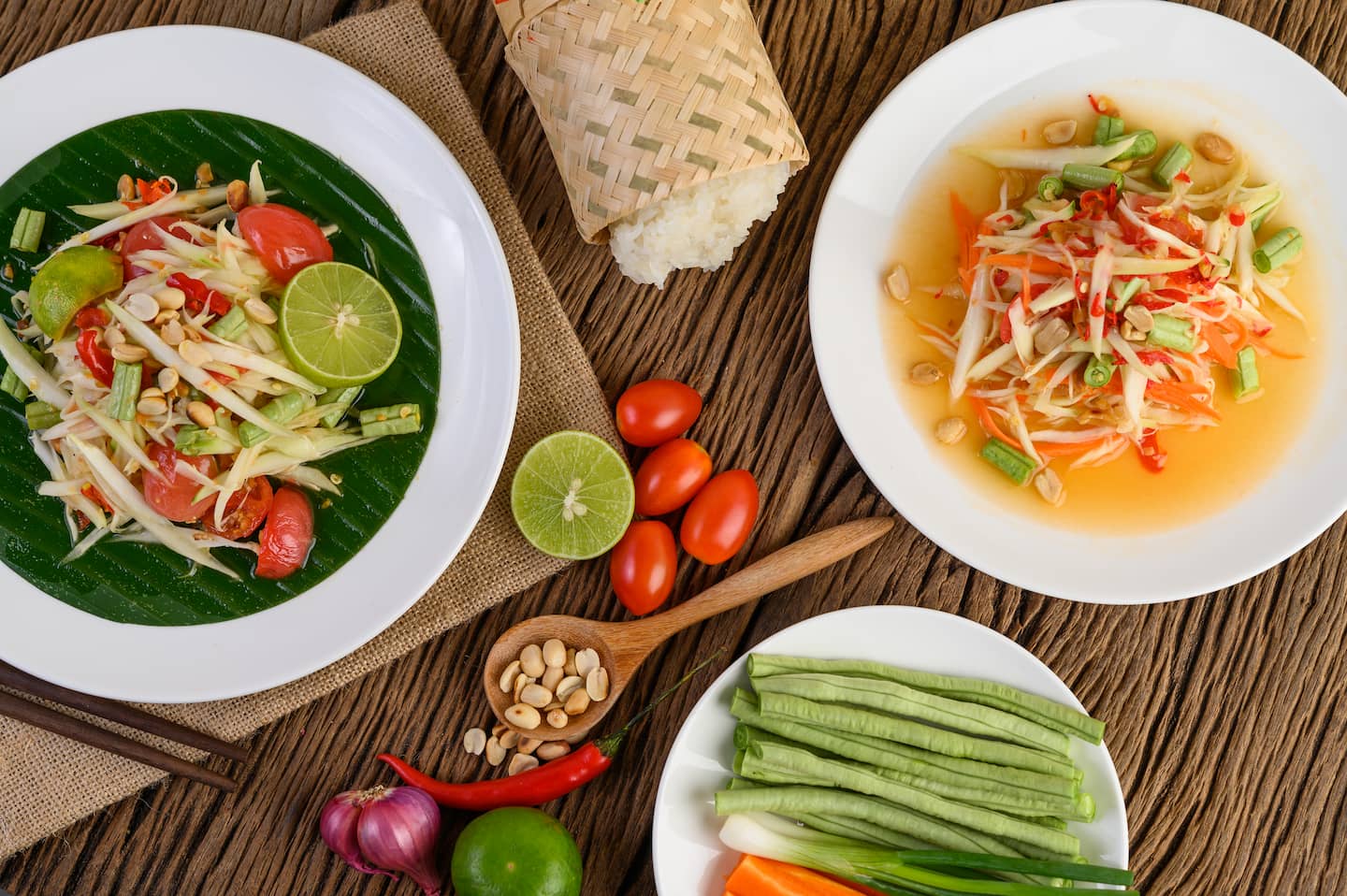 papaya-salad-som-tum-thai-on-a-white-plate-on-a-TV9GRZE.jpg
